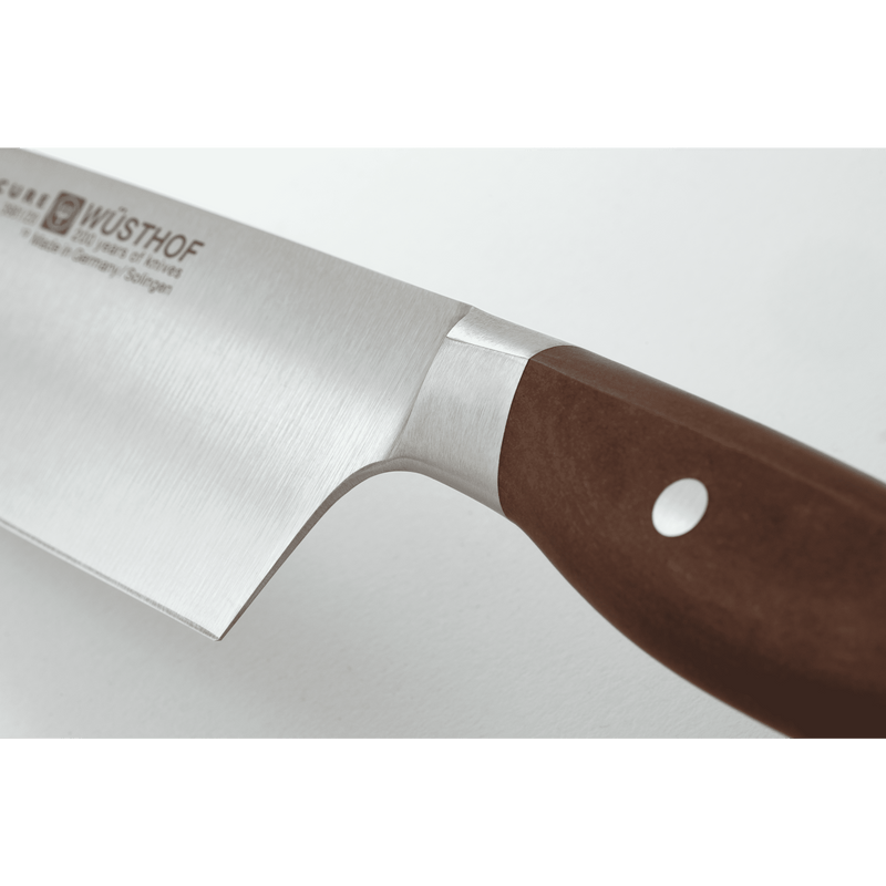 Epicure 6" Chef's Knife with a polished German steel blade and a smooth wooden handle secured by a single rivet for precision cutting.
