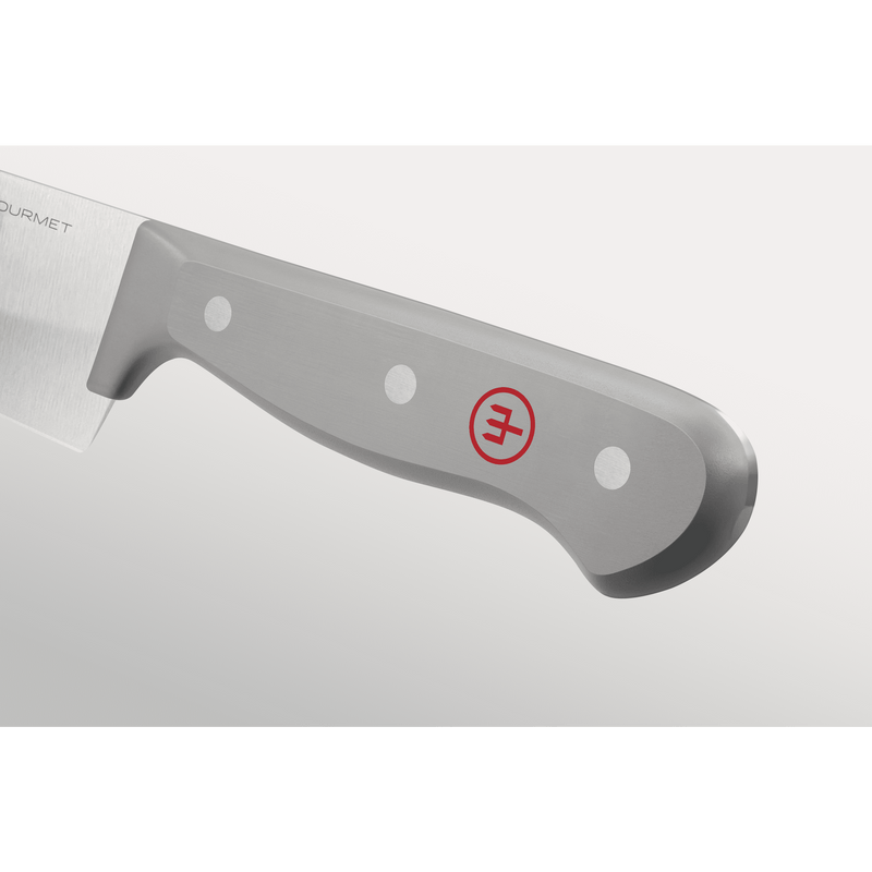 Close-up of a grey ergonomic handle with three metal rivets and a subtle red emblem on a forged German chef's knife from the Gourmet Grey 3-Piece Chef's Set.