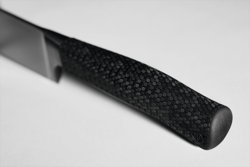 Close-up of the textured ergonomic handle with hexagonal pattern on the Performer 10" Carver designed for secure grip and precision control.