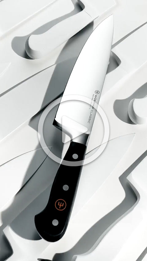 Knife with a black handle on a white background