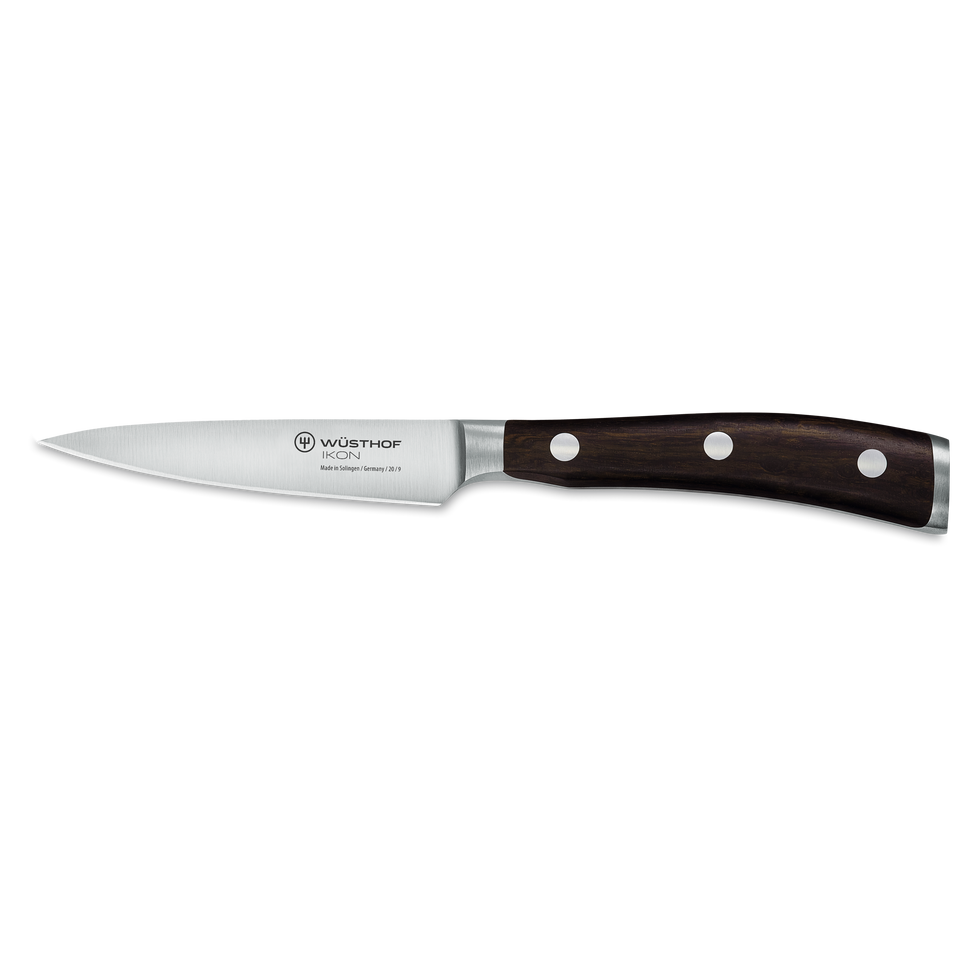 Ikon 3 1/2" Paring Knife with a polished forged stainless steel blade and ergonomic dark wooden handle featuring three rivets for balanced precision cutting.