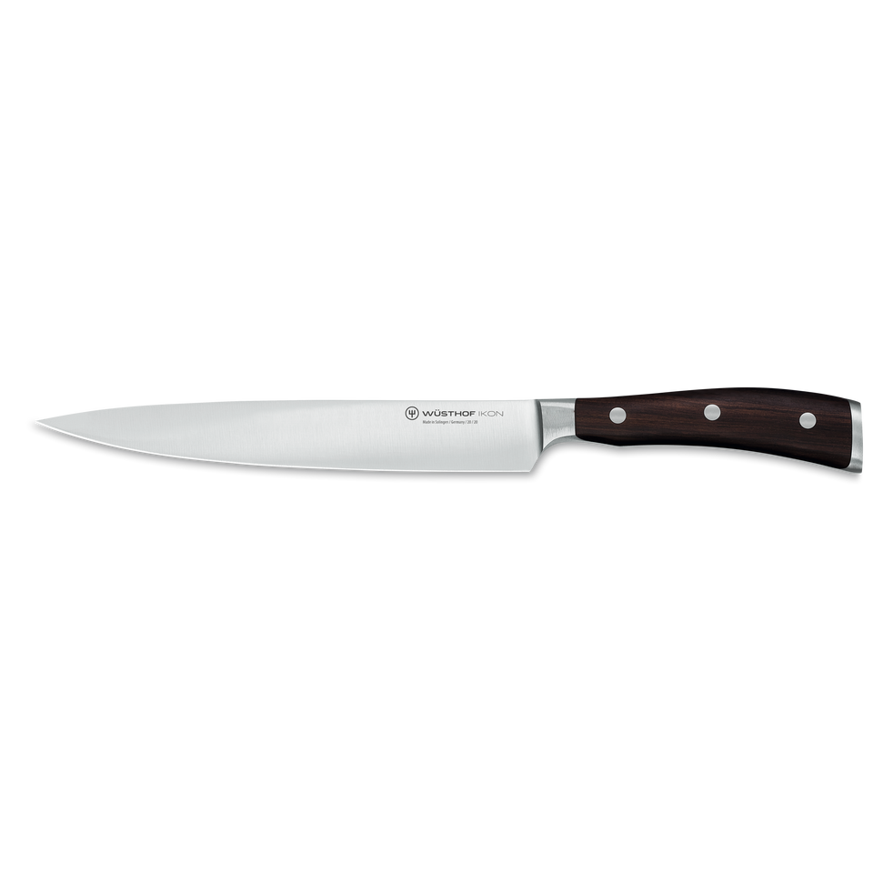 Ikon 8" Carving Knife with forged German steel blade and triple-riveted dark wooden handle, designed for precise slicing and carving tasks.