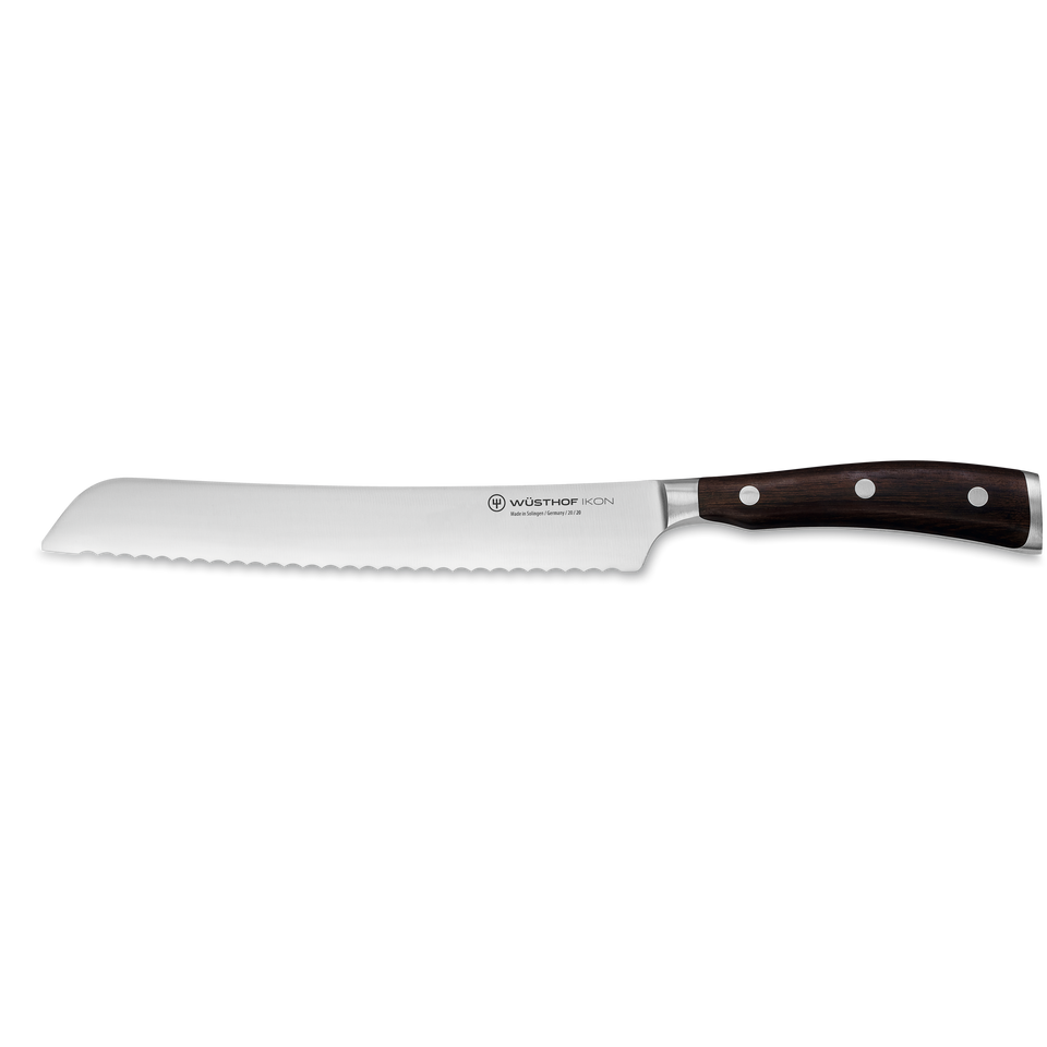 Ikon 8" Bread Knife with a long serrated stainless steel blade and dark wooden handle secured by three rivets for precise slicing and durability.