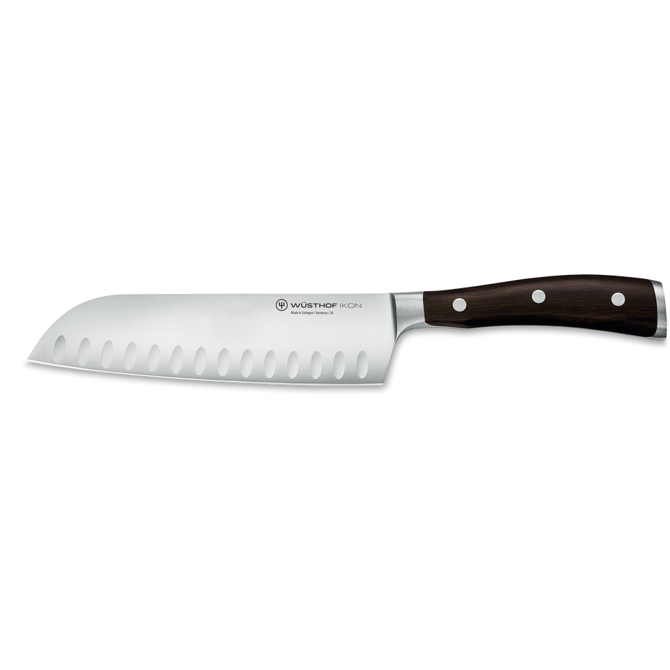 Ikon 7" Hollow Edge Santoku featuring a hollow-ground stainless steel blade with oval indentations and a polished dark wooden handle with three rivets.