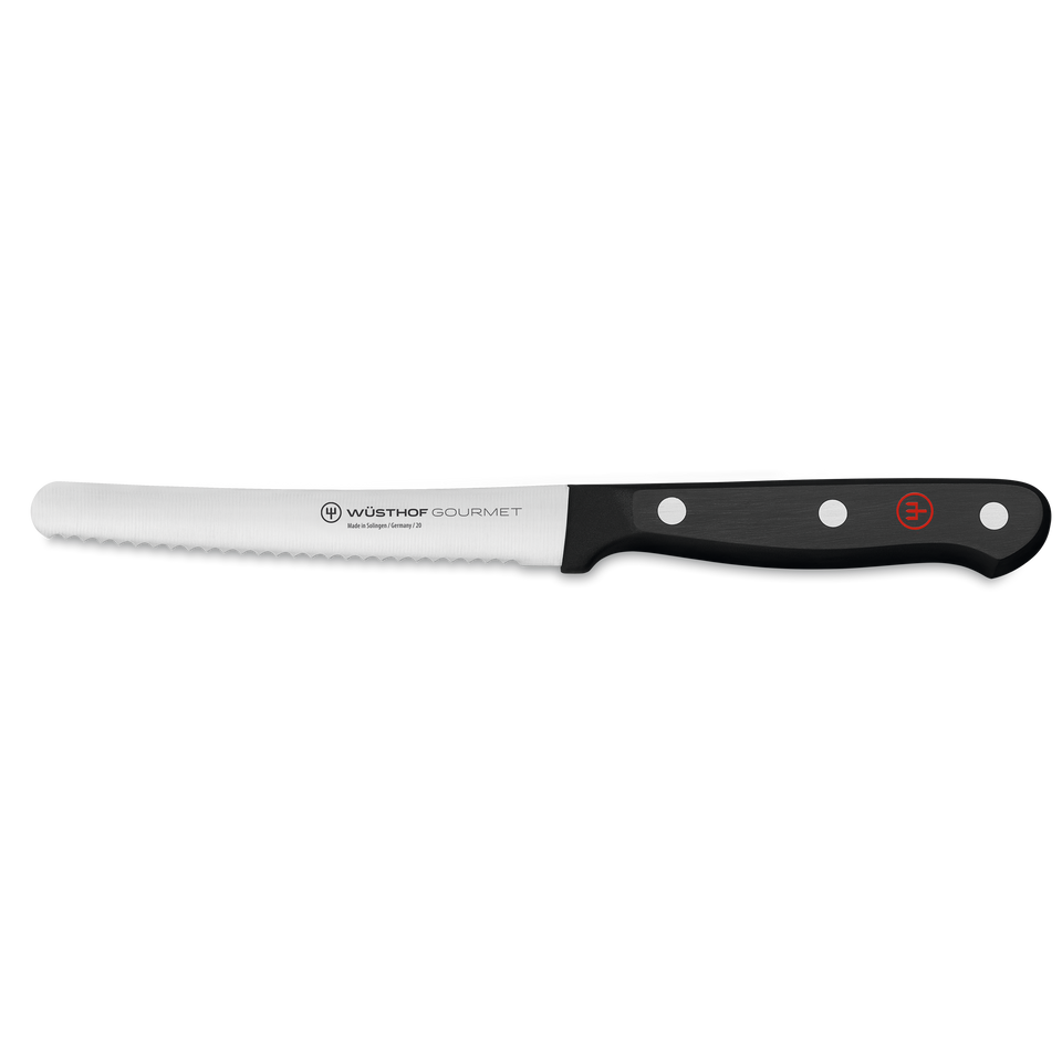 Gourmet 4 1/2" Brunch Knife with a serrated, forged stainless steel blade and a black synthetic handle secured by three rivets and a red emblem.