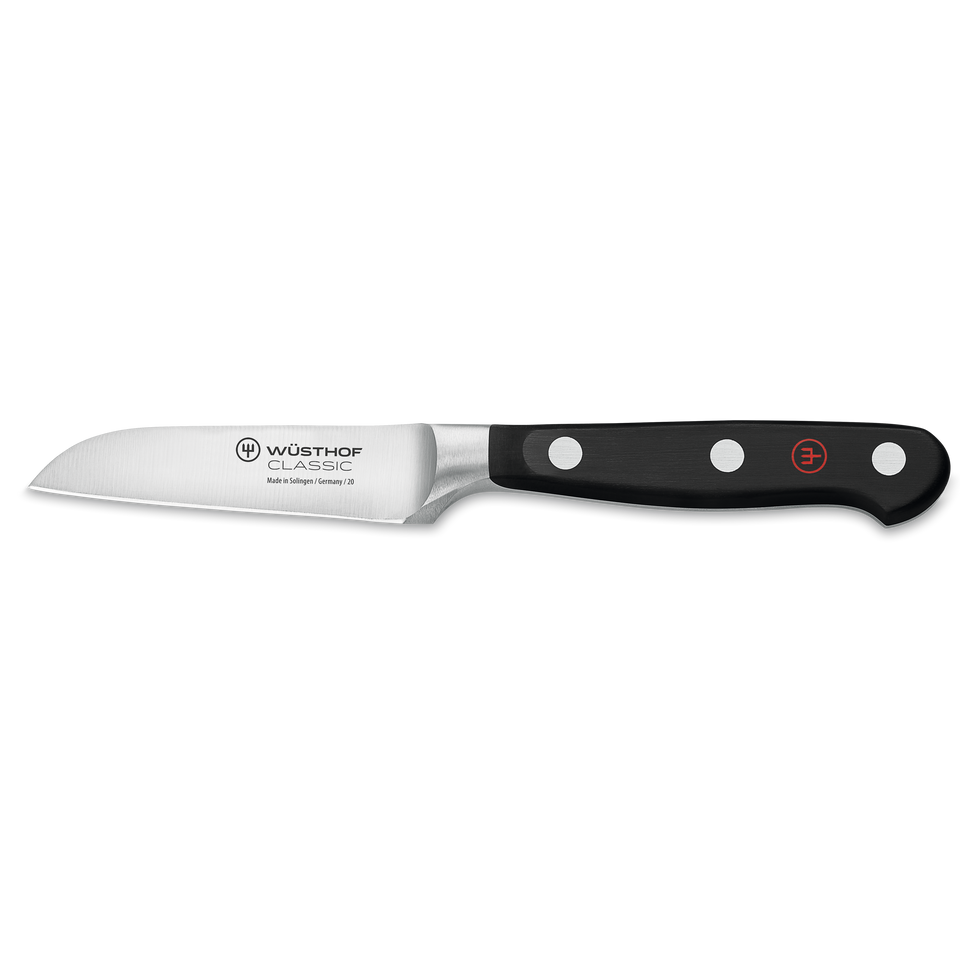 Classic 3" Flat Cut Paring Knife with a sharp, forged stainless steel blade and a black ergonomic handle secured by three rivets for precise cutting tasks.