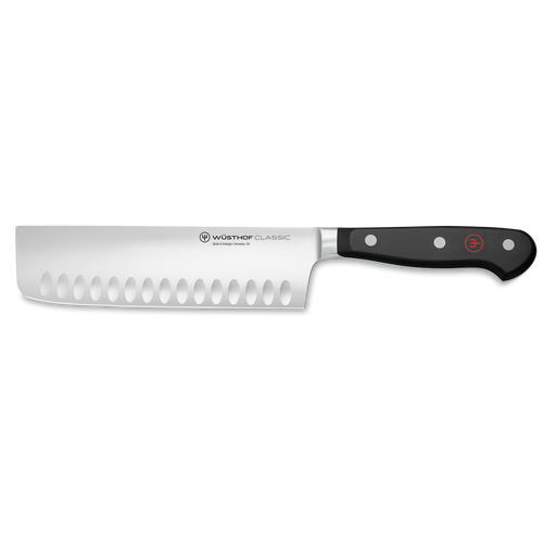Classic 7" Hollow Edge Nakiri featuring a hollow edge German steel blade with scalloped indentations and a triple-riveted black handle for precise vegetable cutting.