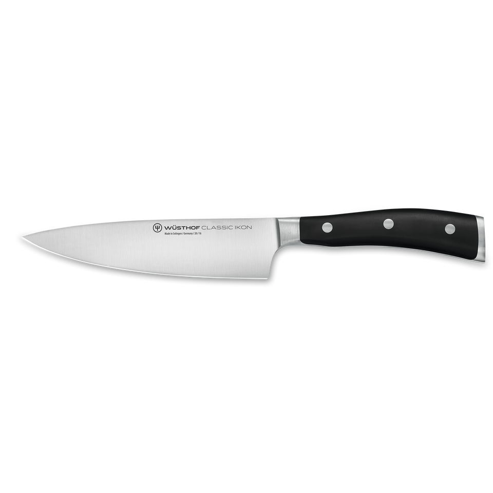 Classic Ikon 6" Chef's Knife featuring a forged German steel blade and triple-riveted ergonomic black handle for precise, versatile cutting in the kitchen.