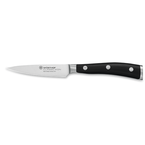 Classic Ikon 3 1/2" Paring Knife with a sharp forged German steel blade and triple-riveted black handle for precise peeling and intricate kitchen tasks.