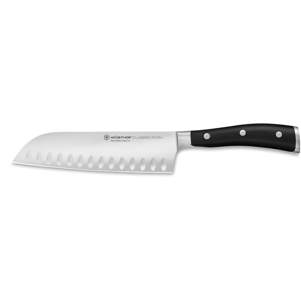 Classic Ikon 7" Hollow Edge Santoku with a forged German steel blade featuring scalloped hollows and a smooth triple-riveted black handle for precise kitchen cutting.