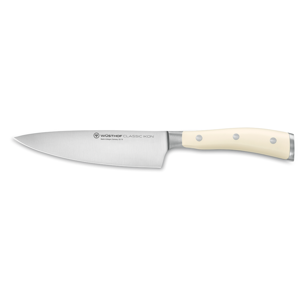 Classic Ikon 6" Chef's Knife with a sharp forged German steel blade and a smooth, triple-riveted white handle for comfortable and precise kitchen cutting.