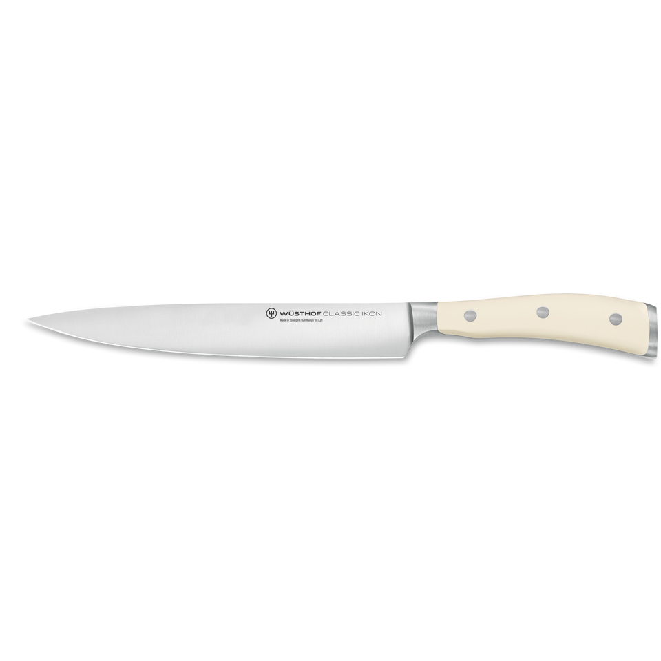 Classic Ikon 8" Carving Knife featuring a long, narrow forged stainless steel blade and a smooth, triple-riveted cream-colored handle for precise slicing.
