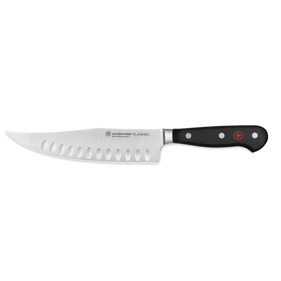 Classic 7" Hollow Edge Craftsman featuring a forged German steel blade with hollow-ground indentations and a durable triple-riveted black ergonomic handle.