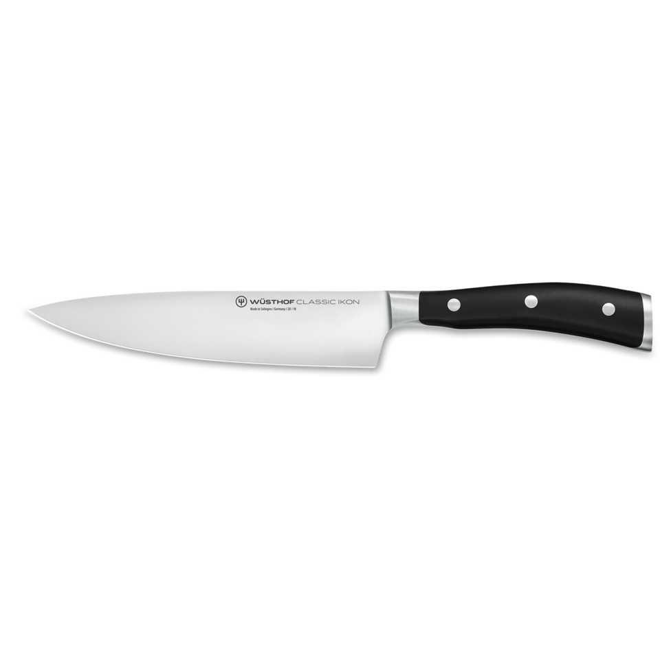 Classic Ikon 7" Chef's Knife featuring a forged German stainless steel blade and a triple-riveted black handle for precision cutting and durability.