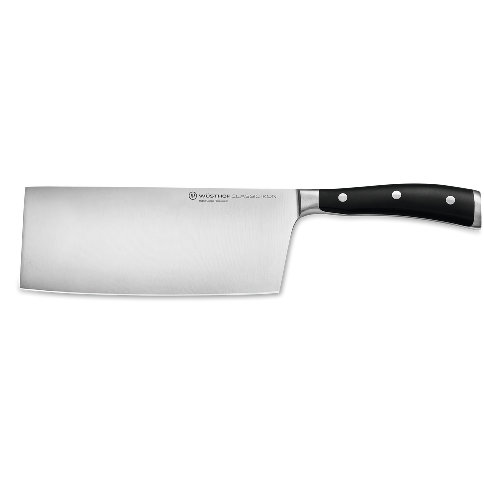 Classic Ikon 7" Chinese Chef's Knife featuring a wide forged German blade with polished stainless steel and a black ergonomic handle with triple rivets.