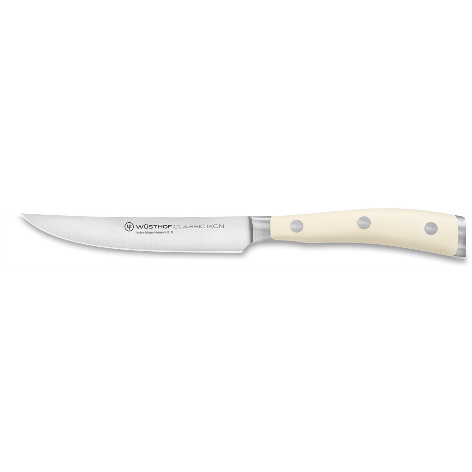 Classic Ikon 4 1/2" Steak Knife with a finely forged German steel blade and smooth triple-riveted ivory handle for precise and elegant steak cutting.