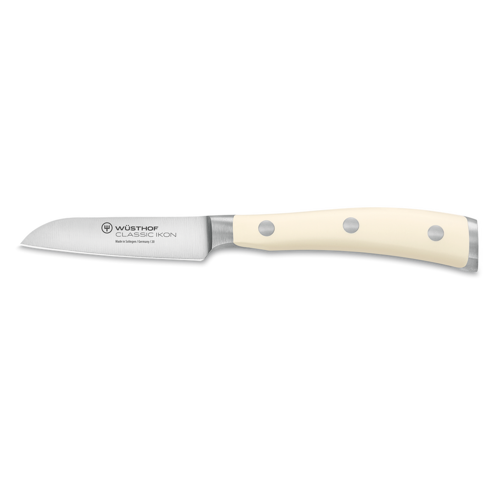 Classic Ikon 3" Flat Cut Paring Knife with a finely forged German steel blade and smooth ivory handle with triple rivets for detailed kitchen tasks.