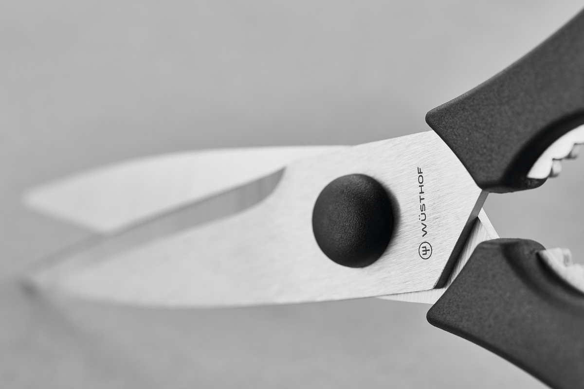 Pull-Apart Kitchen Shears featuring stainless steel blades with a polished finish and ergonomic black handles for comfortable and efficient food preparation.