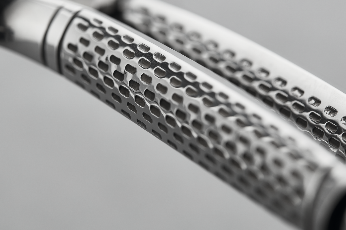 Close-up view of the textured stainless steel handles on the 10" Stainless Steel Poultry Shears designed for secure grip and precise cutting.