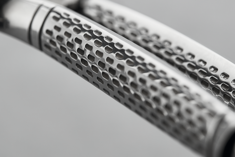 Close-up view of the textured stainless steel handles on the 10" Stainless Steel Poultry Shears designed for secure grip and precise cutting.
