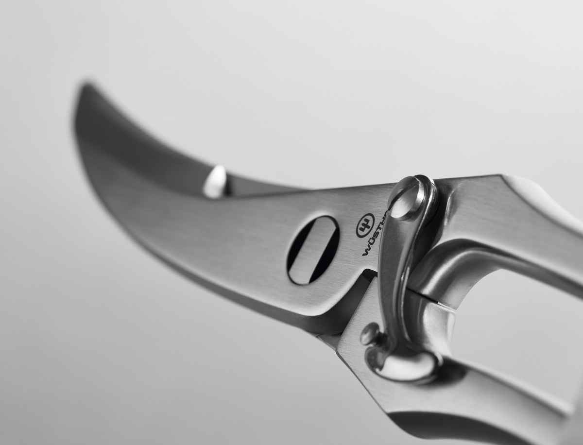 9" Stainless Steel Poultry Shears with precision curved blades and a secure locking mechanism, crafted from durable polished stainless steel.