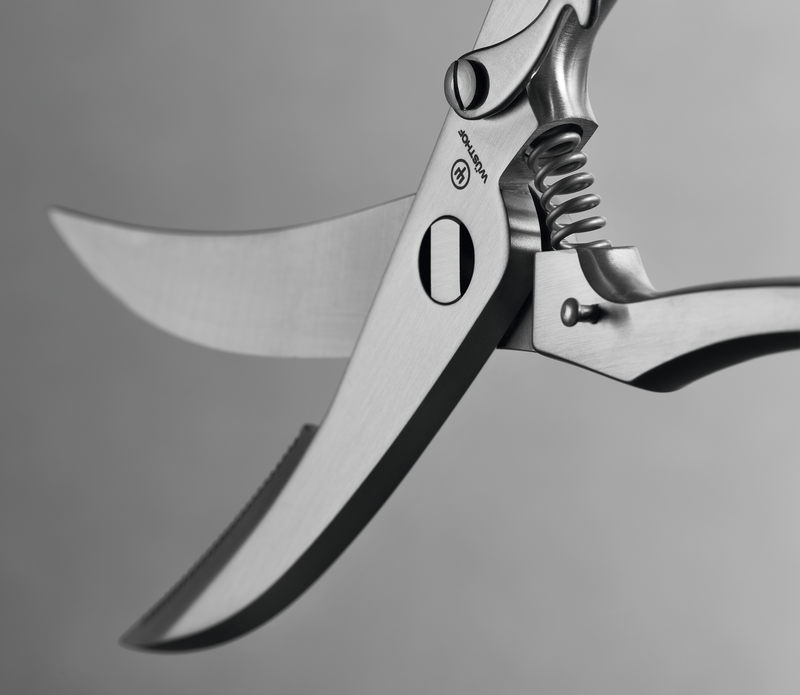 9" Stainless Steel Poultry Shears with curved blades, a strong spring mechanism, and a durable all-metal construction for precise cutting.