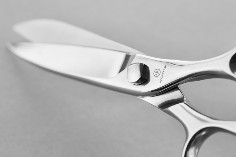 8" Kitchen Shears featuring polished stainless steel blades and a sturdy rivet joint designed for precision and durability in food preparation.