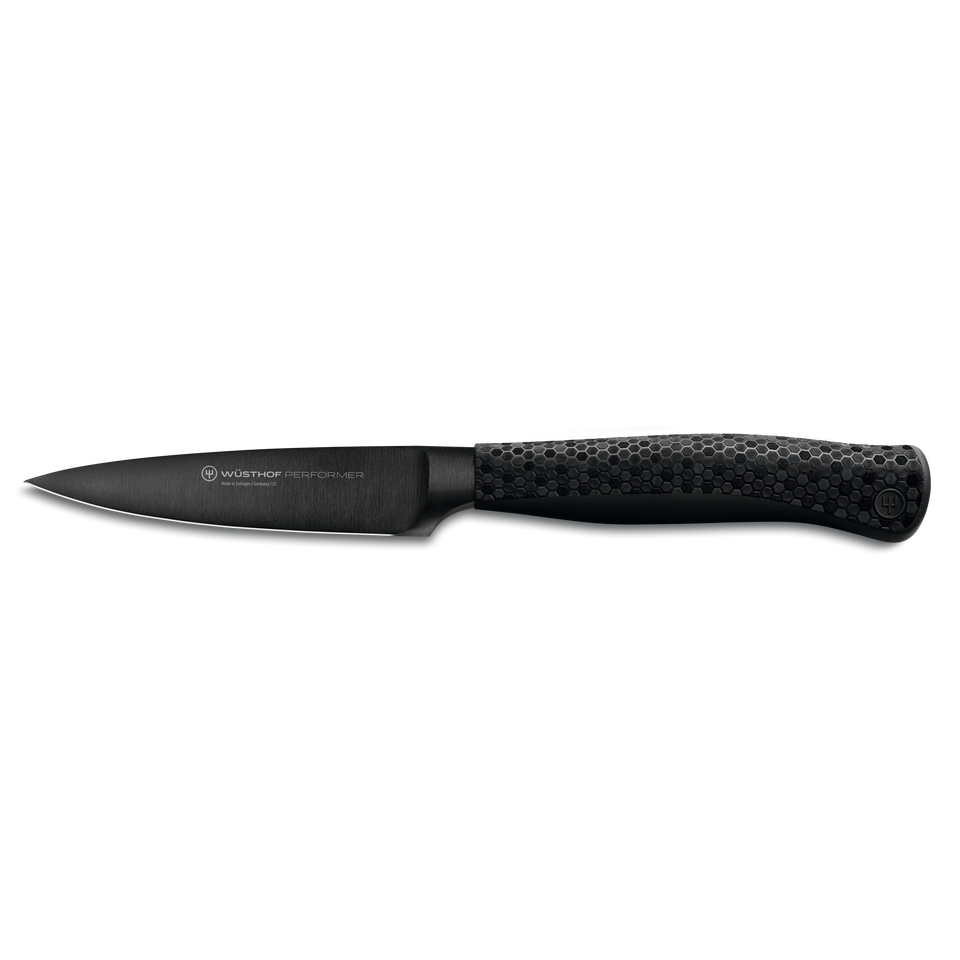 Performer 3 1/2" Paring Knife with a sleek black blade and textured ergonomic handle, crafted for precise and comfortable kitchen cutting.