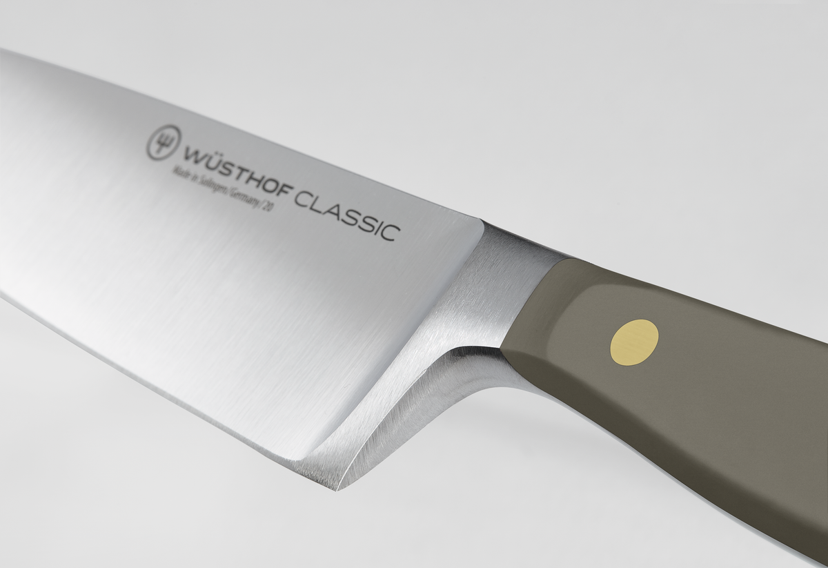 Classic 8" Chef's Knife showcasing a polished forged German steel blade with a smooth matte grey handle featuring a single brass rivet for balance and control.