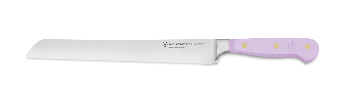 Classic 3-Piece Essential Knife Set - Purple Yam showing a serrated forged German bread knife with sharp stainless steel blade and ergonomic lavender handle with brass rivets.