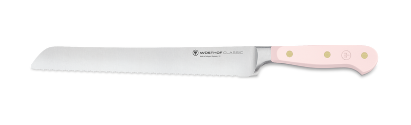 Classic 3-Piece Essential Knife Set - Pink Himalayan Salt featuring a forged German serrated bread knife with sharp stainless steel blade and ergonomic pink handle with brass rivets.