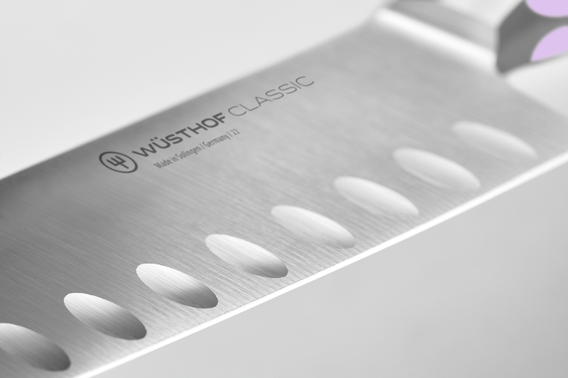 Classic 7" Hollow Edge Santoku with forged German steel featuring scalloped indentations to minimize food sticking for clean, efficient slicing.