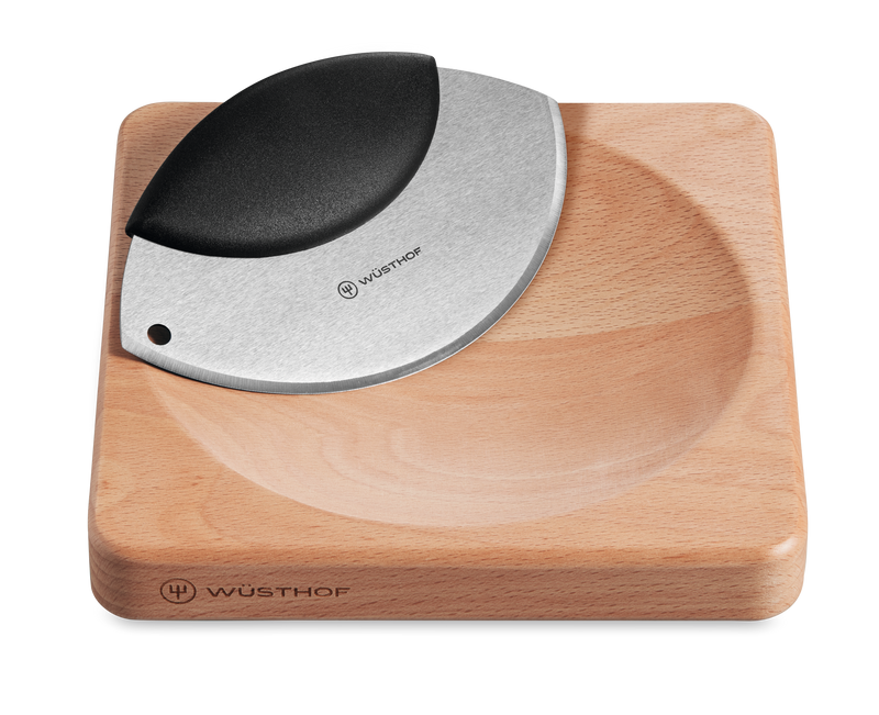 2-Piece Mincing Set featuring a curved forged stainless steel blade with a black ergonomic handle and a compact natural wood cutting board with a carved groove.