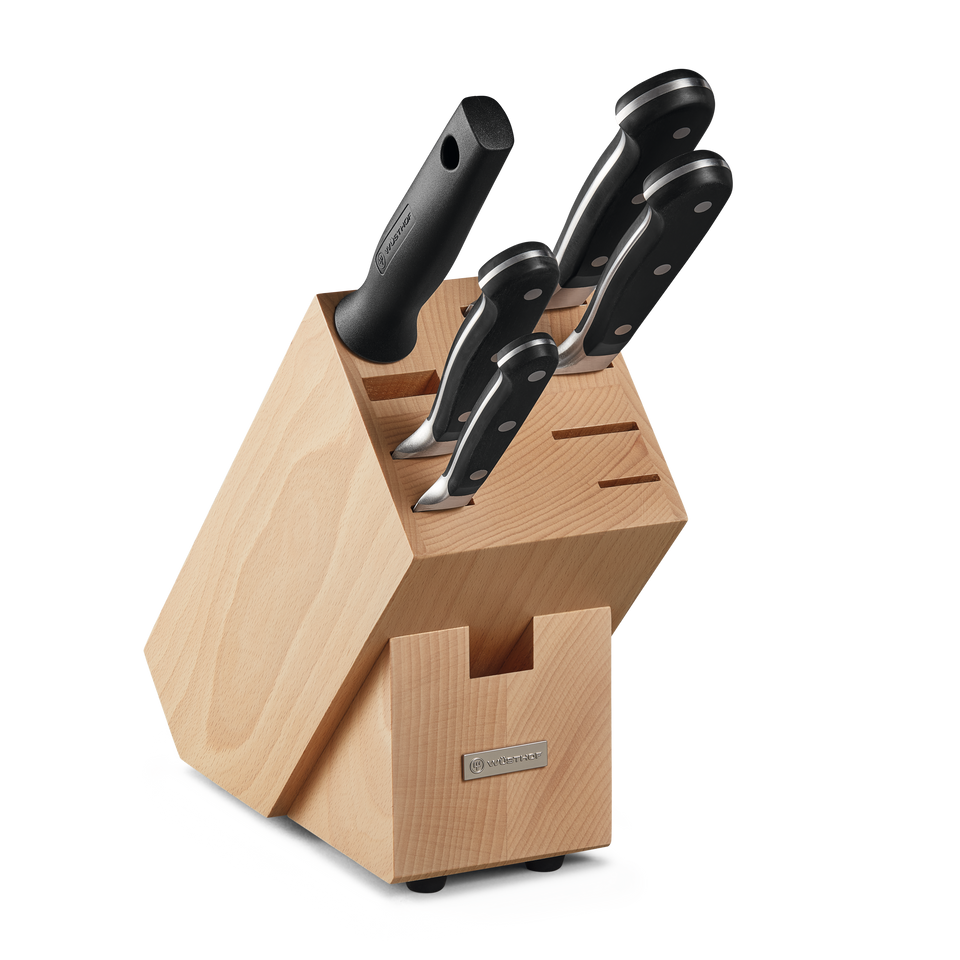 Classic 6-Piece Knife Block Set featuring forged German knives with polished stainless steel blades and black ergonomic handles in a light wooden block.