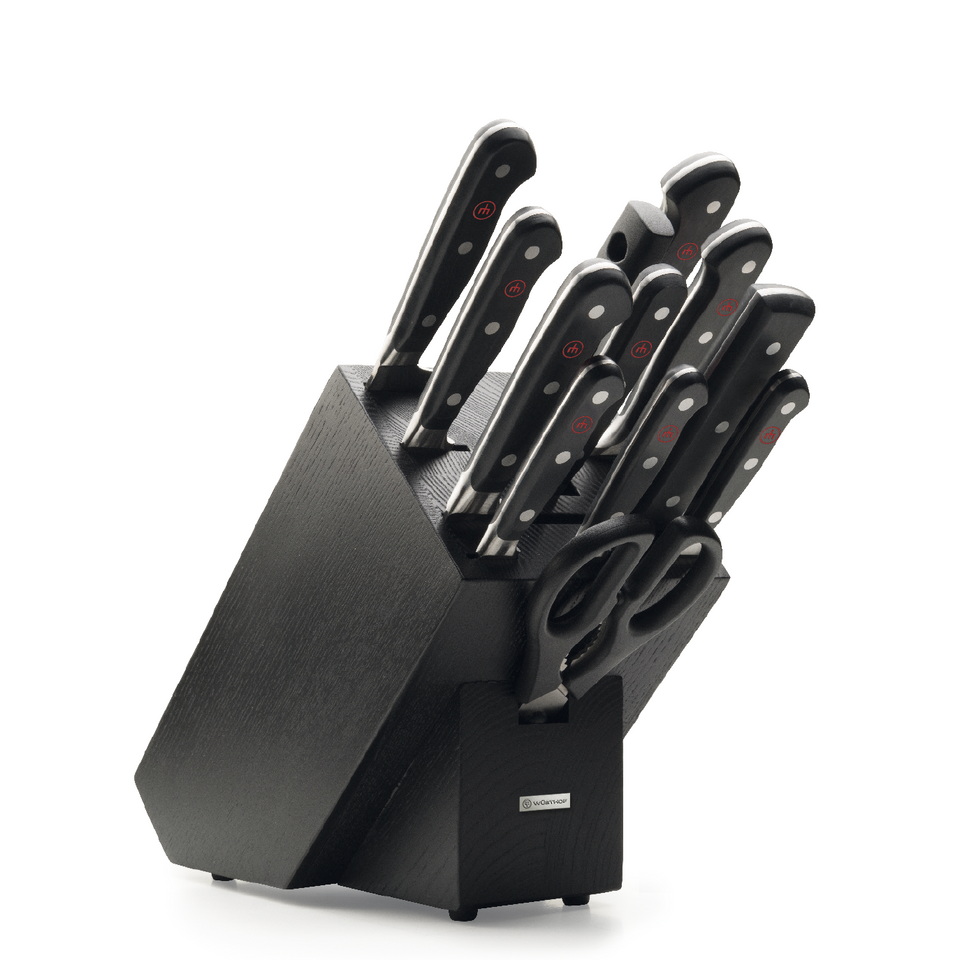 Classic 13-Piece Knife Block Set featuring forged German knives with ergonomic black handles and a dark wood block including kitchen scissors.