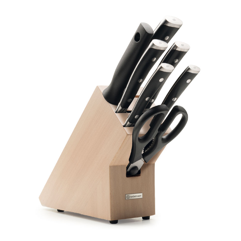 Classic Ikon 8-Piece Starter Knife Block Set featuring forged German kitchen knives with polished stainless steel blades, black ergonomic handles, and kitchen shears in a light wooden block.
