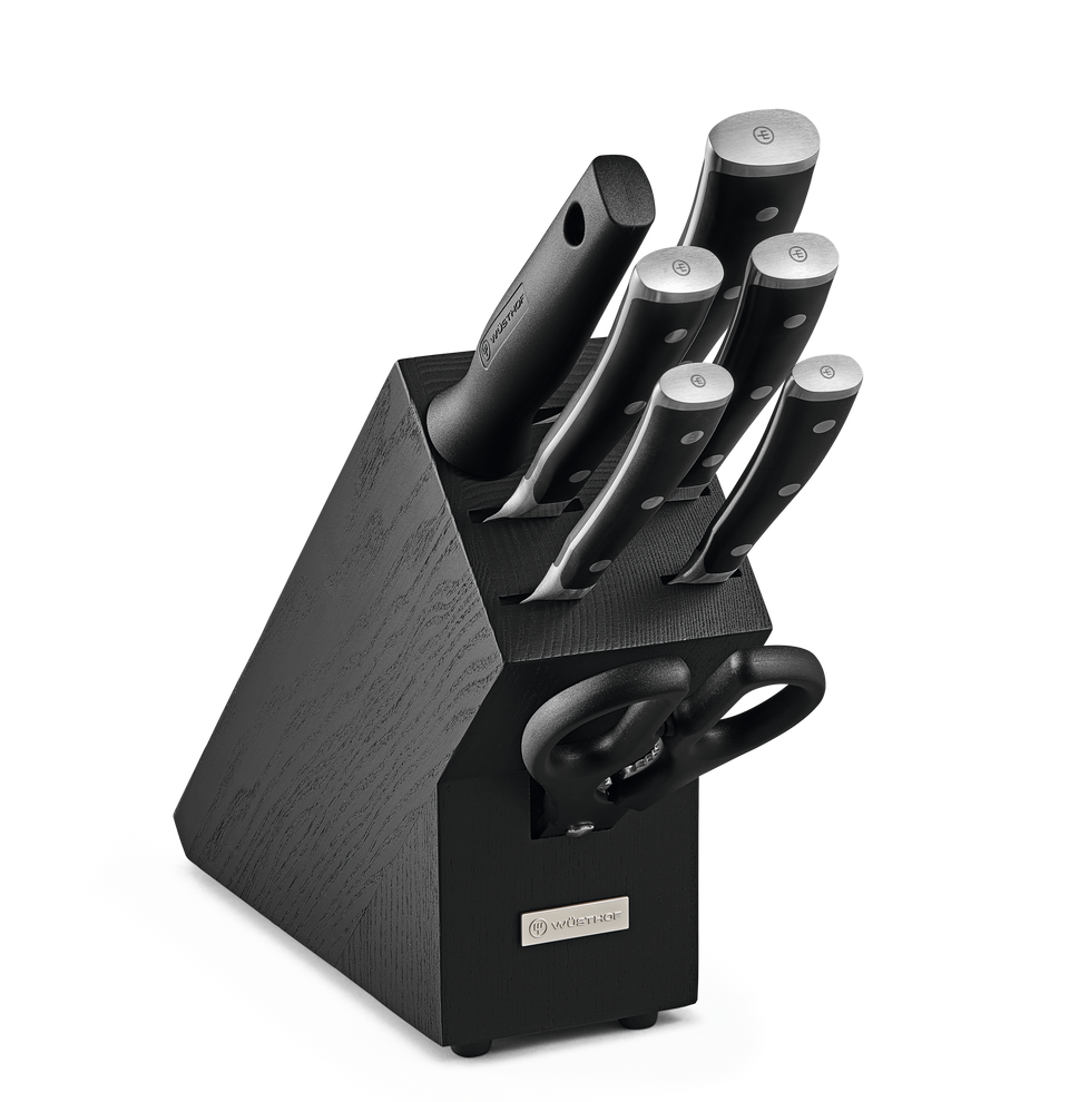Classic Ikon 8-Piece Starter Knife Block Set featuring forged German knives with polished stainless steel blades, black ergonomic handles, and kitchen shears in a dark wooden block.