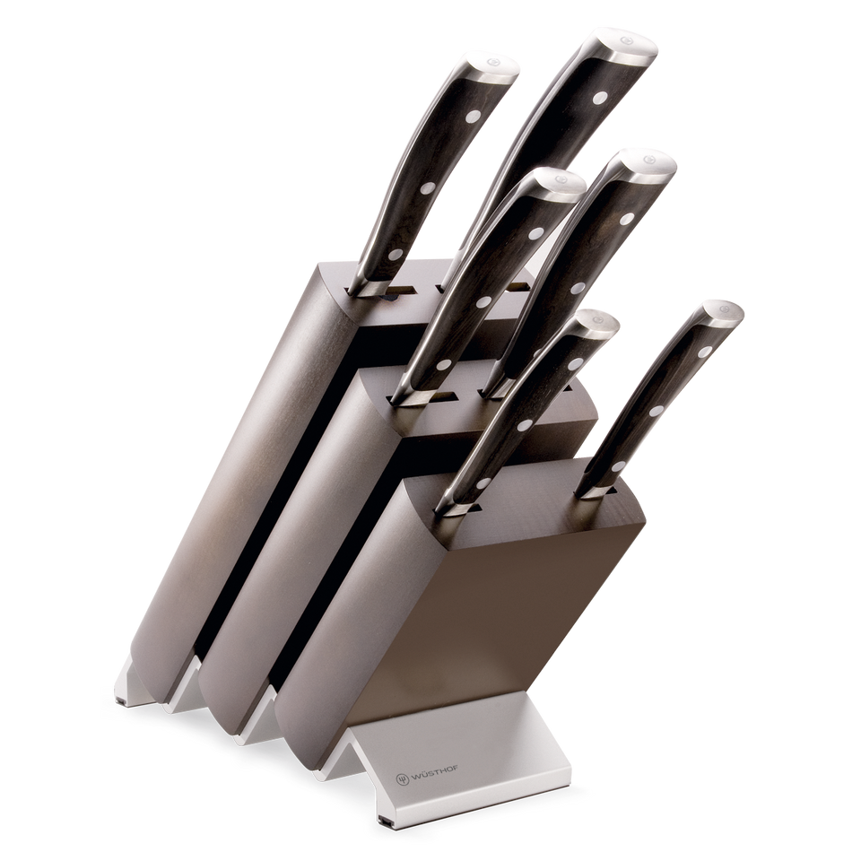 Ikon 7-Piece Knife Block Set with forged German steel blades, featuring triple-riveted dark wooden handles and an angled dark wood block for organized kitchen storage.