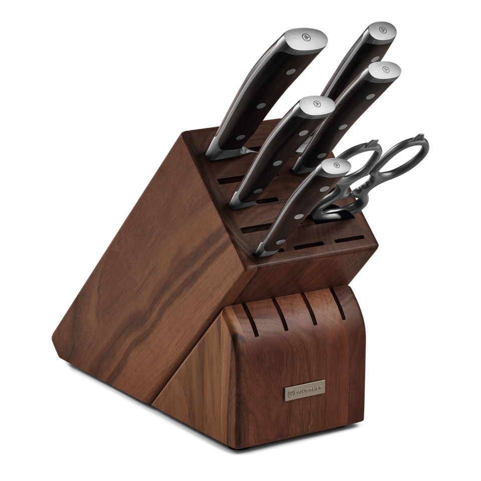 Ikon 7-Piece Knife Block Set featuring forged German steel blades with polished stainless steel bolsters and contoured dark handles in a rich wooden block with storage slots.