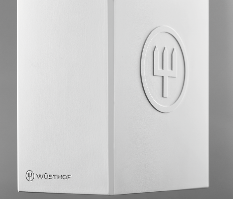 Create Knife Block close-up showcasing a smooth white surface with an embossed WÜSTHOF logo and clean minimalist design details.