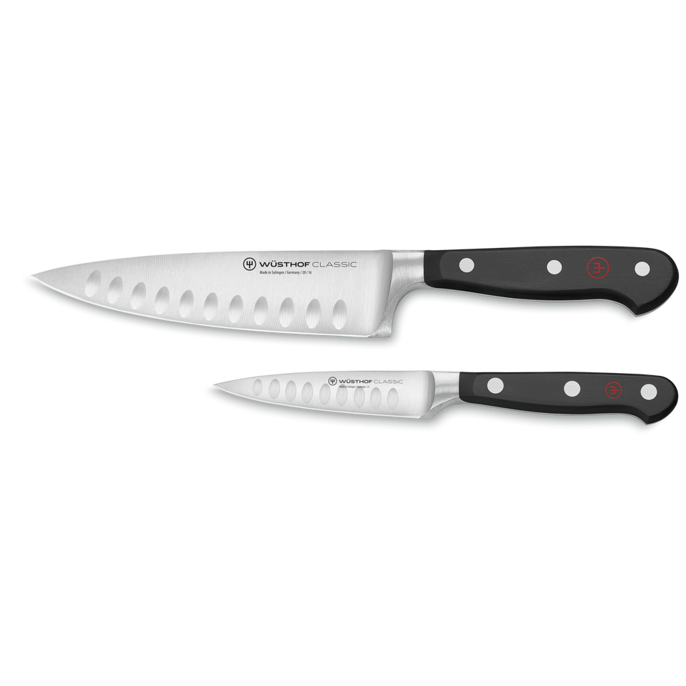Classic 2-Piece Hollow Edge Chef's Knife Set featuring two forged German knives with hollow grind blades and black ergonomic handles with polished rivets.