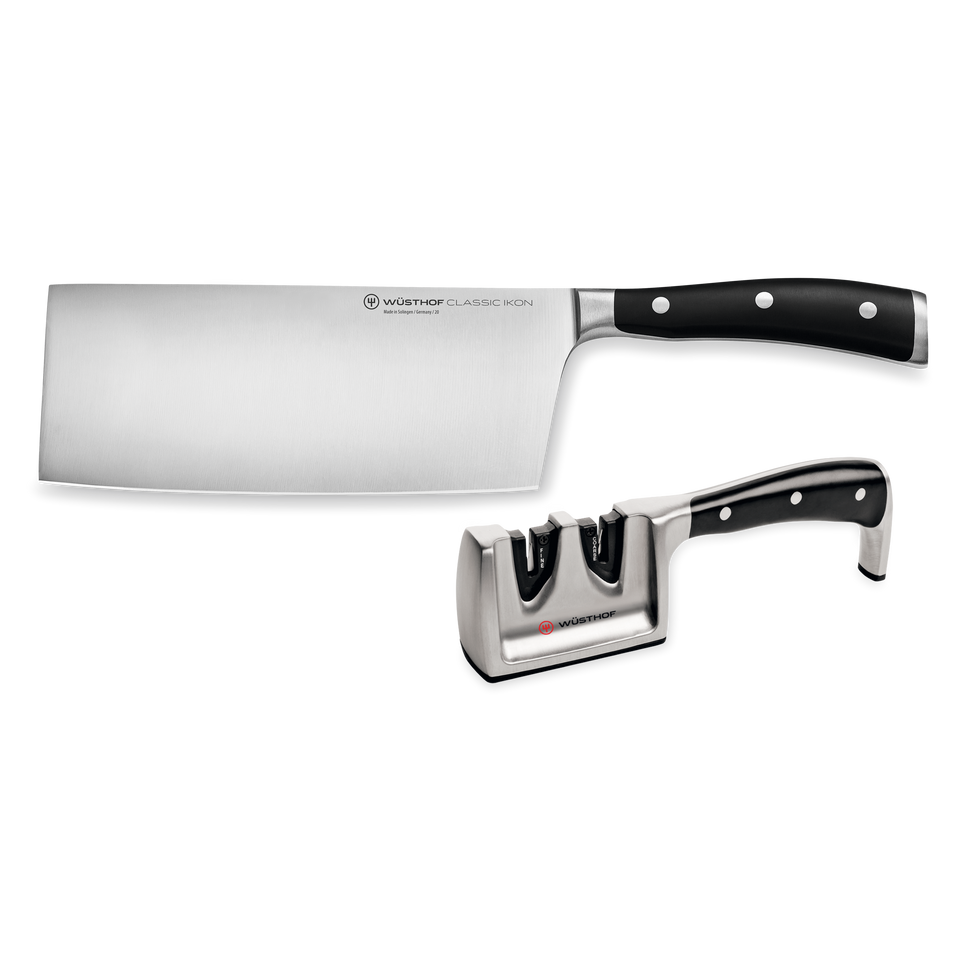 Classic Ikon 2-Piece Chinese Chef's Knife and Sharpener Set featuring a forged German knife with polished stainless steel blade and black ergonomic handle, paired with a matching dual-stage sharpener.