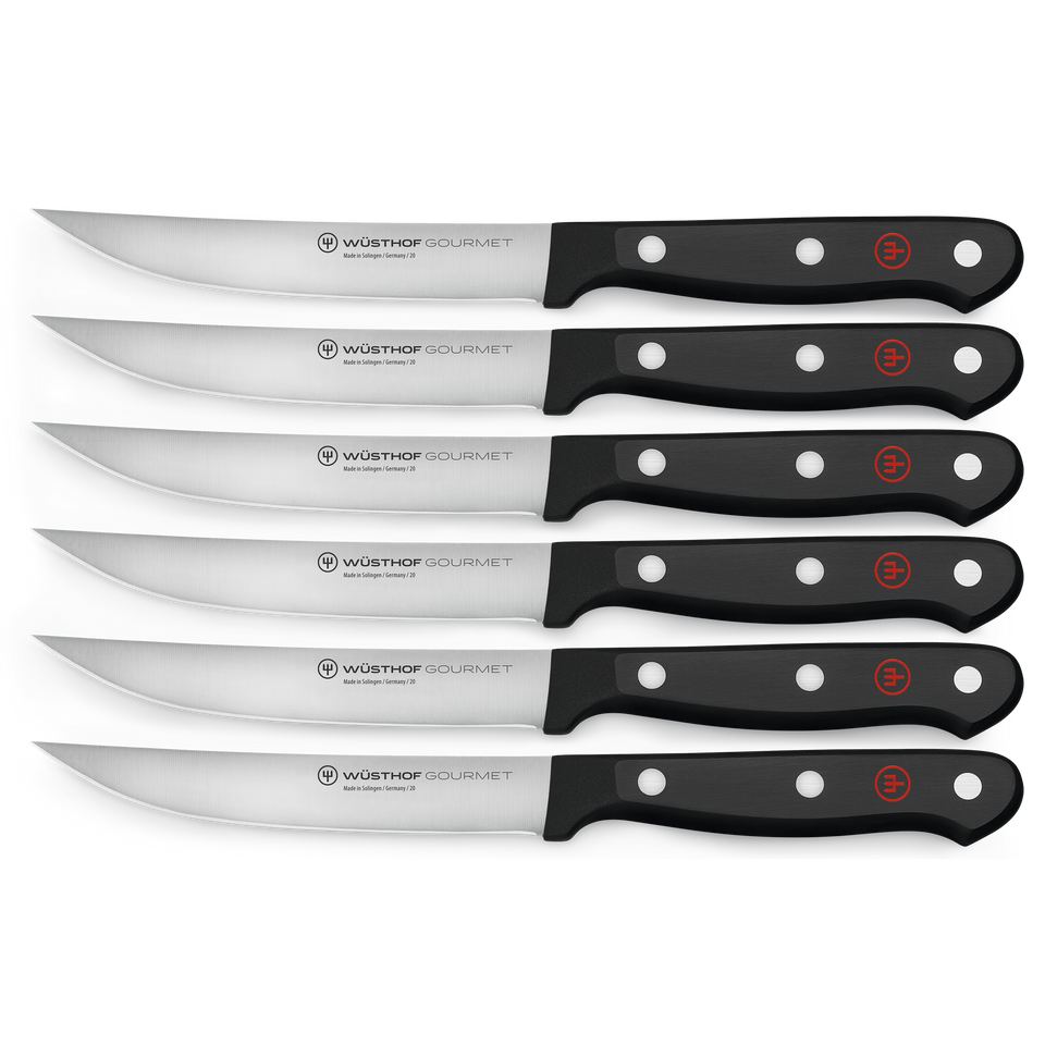 Gourmet 6-Piece Steak Knife Set featuring curved serrated German steel blades and durable black triple-riveted handles with red logo for precision cutting.