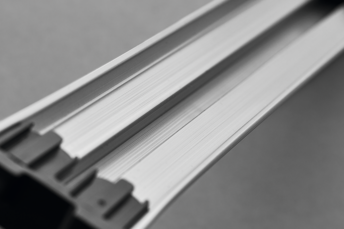 Close-up of the brushed metal surface and edge detail of the 18" Magnetic Holder designed for organizing forged kitchen knives.