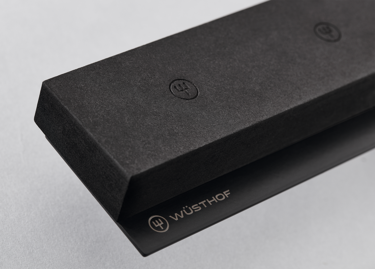 16" Magnetic Holder with a matte black finish featuring embossed logos and a subtle WÜSTHOF emblem designed for secure knife storage.