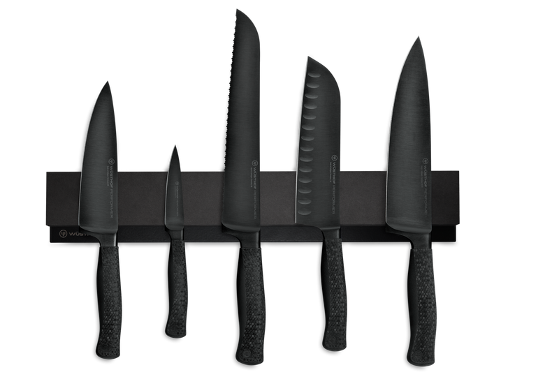 16" Magnetic Holder secures a set of black forged kitchen knives with textured handles, showcasing precision and modern design.