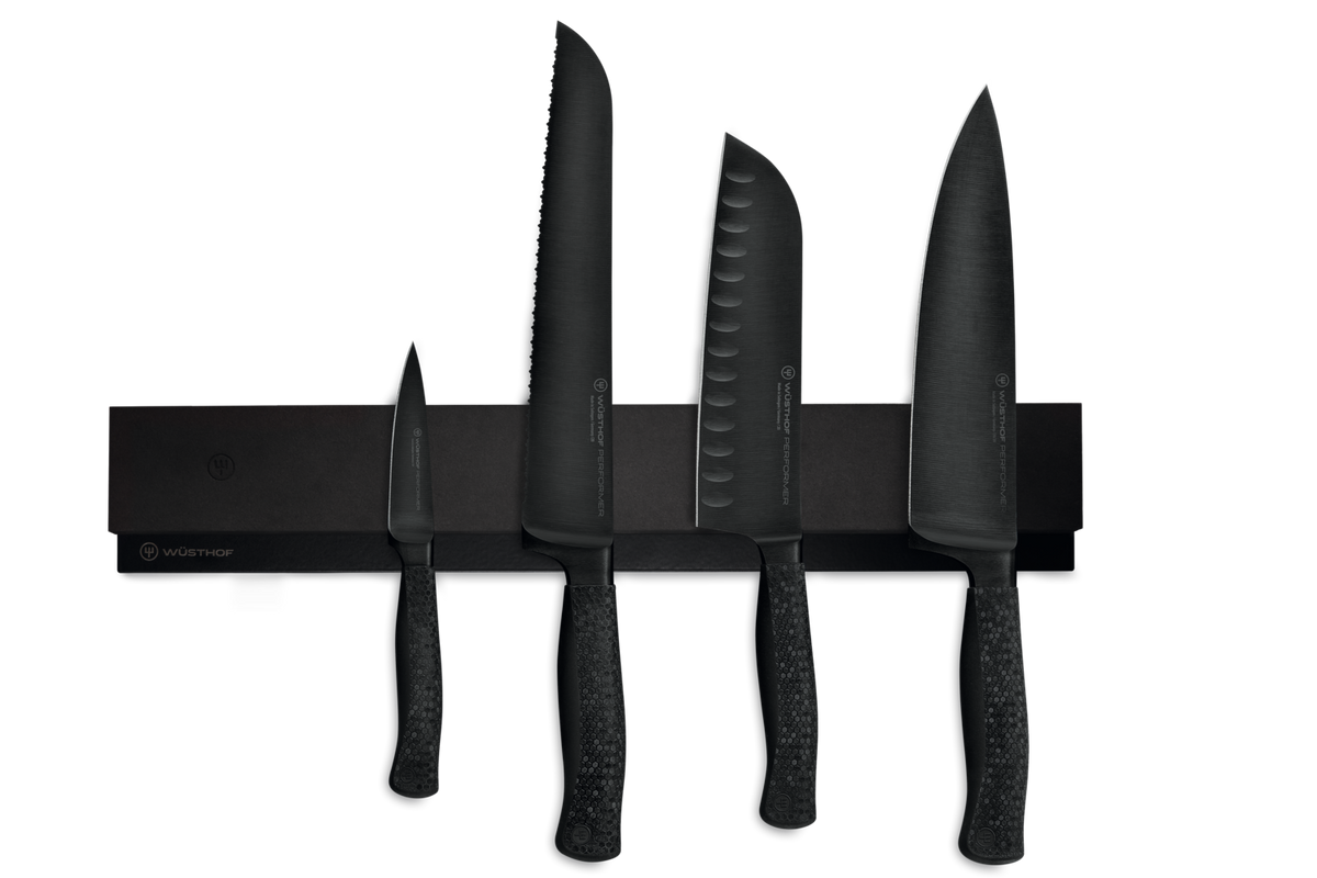 16" Magnetic Holder displaying a set of black forged kitchen knives with textured handles, highlighting sleek German craftsmanship.