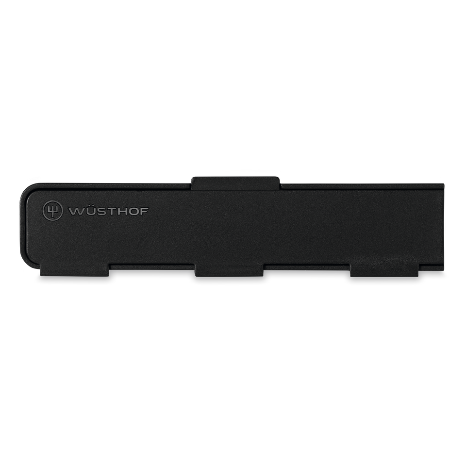 Narrow Magnetic Blade Guard in matte black with discreet WÜSTHOF logo, designed to protect and safely store chef’s knives.