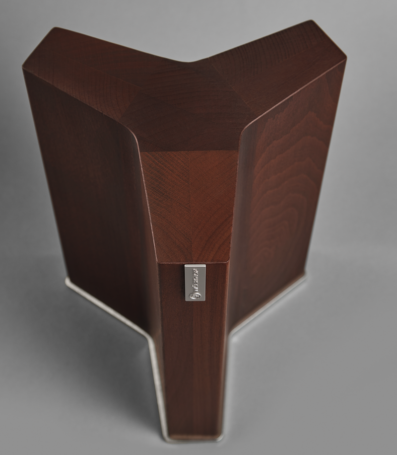 Magnetic Knife Block with a dark wood finish featuring a unique triangular design and a metal brand logo for stylish kitchen storage.