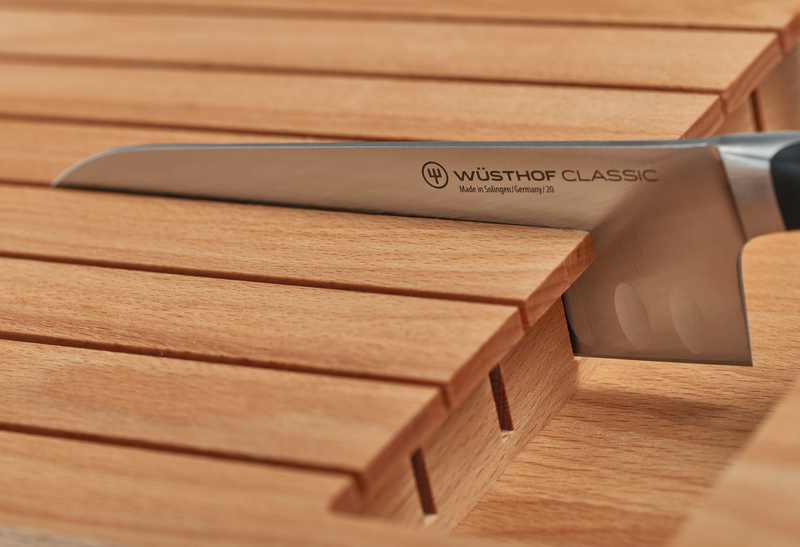 7-Slot In-Drawer Knife Tray made of natural wood featuring slotted compartments to securely hold a forged WÜSTHOF Classic kitchen knife.